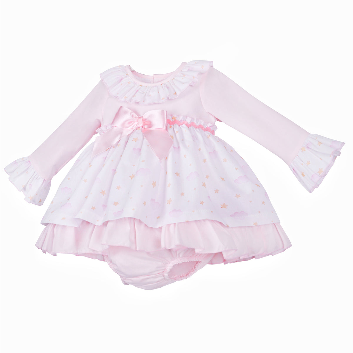 Angled view of the long-sleeved pink cloud and star dress with matching pants