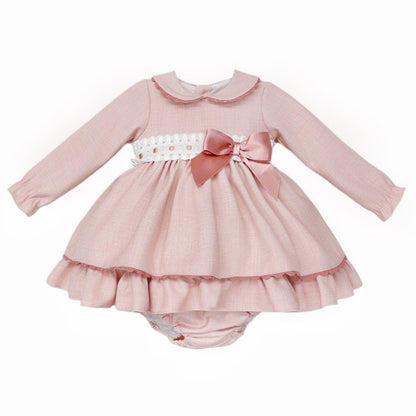 Pink dress and matching pants with white broderie waistband, rose-pink bow and rounded collar, front view