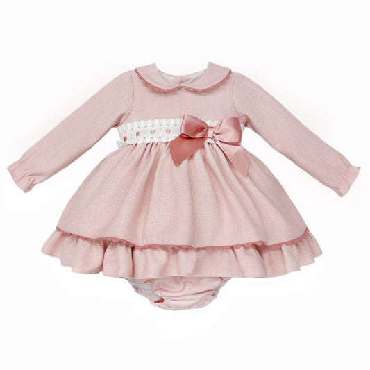 Pink dress and matching pants with white broderie waistband, rose-pink bow and rounded collar, front view