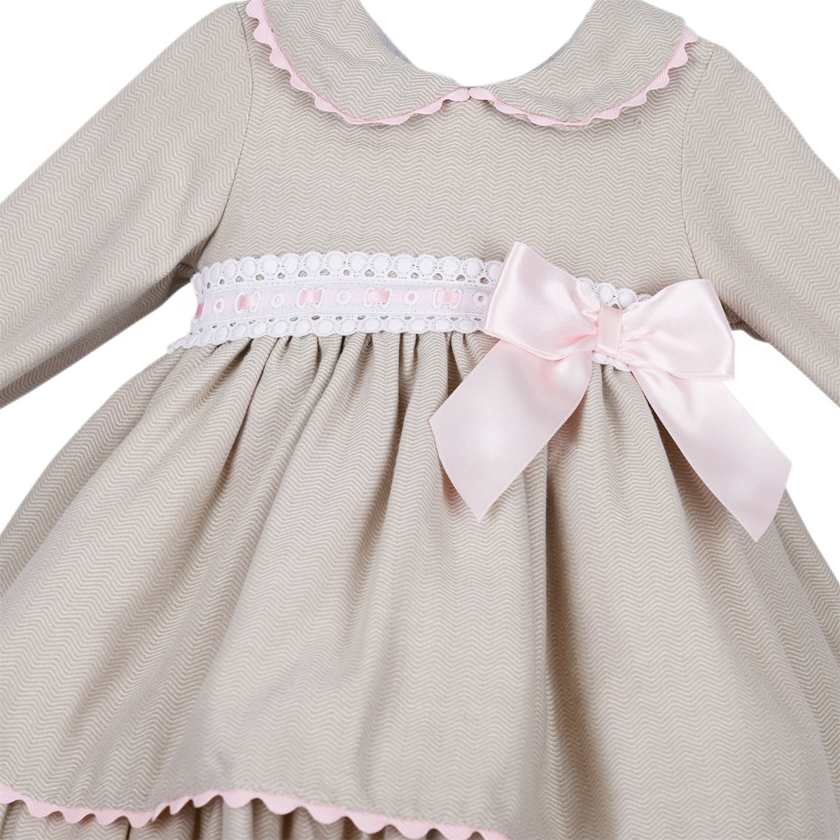 Detail of the fine wavy pattern, pink ribbon-threaded white trim and side bow