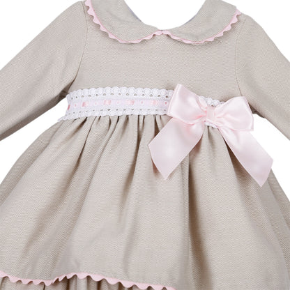 Detail of the fine wavy pattern, pink ribbon-threaded white trim and side bow