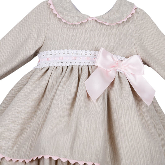 Detail of the fine wavy pattern, pink ribbon-threaded white trim and side bow