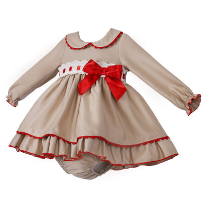 Angled view of the grey and red dress showing gathered cuffs, hem frill and matching pants