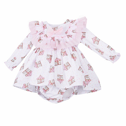 Angled view of the pink carousel dress showing long sleeves and matching printed pants