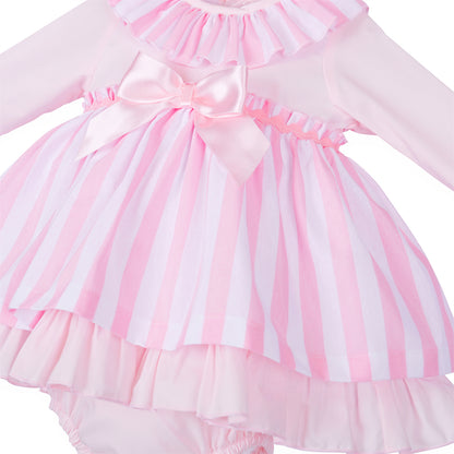 Close-up of pink and white stripes, glossy waist bow and wavy pink trim