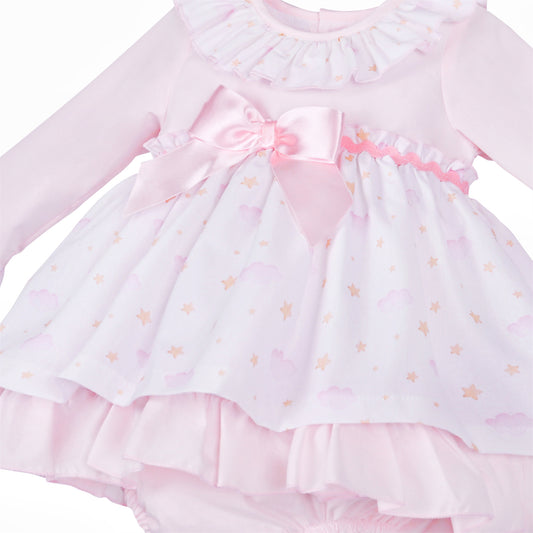 Close-up of the pink waist bow, wavy trim and cloud and star print