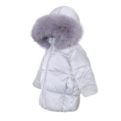 Side view of silver puffer coat with long sleeves and grey faux-fur hood trim