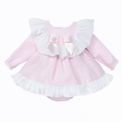 Pale pink long-sleeved baby dress with white ruffle collar and bow