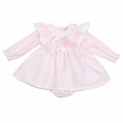 Pale pink long-sleeved baby dress with white ruffles and satin bow