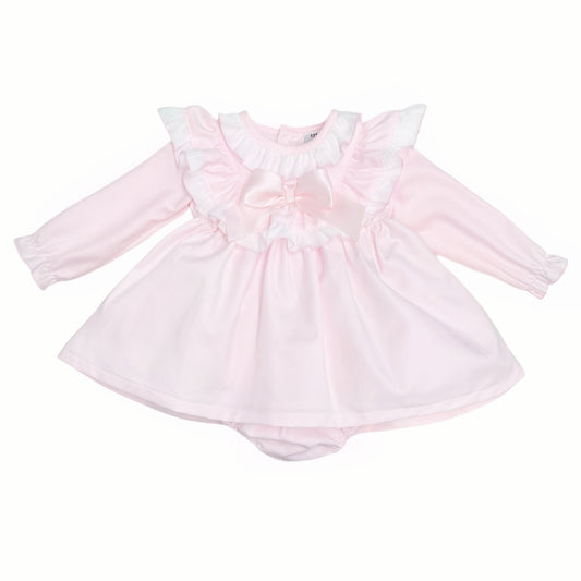 Pale pink long-sleeved baby dress with white ruffles and satin bow